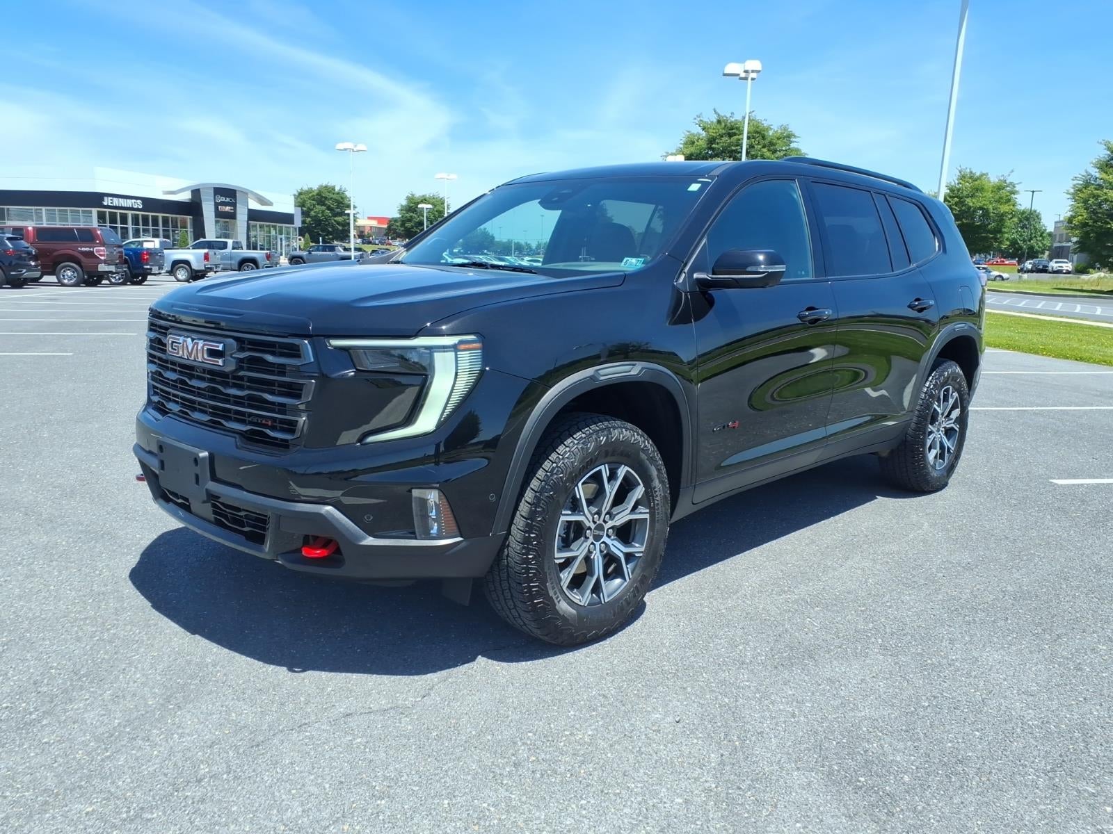 2024 GMC Acadia AT4 in Ebony Twilight Metallic — front three-quarter view