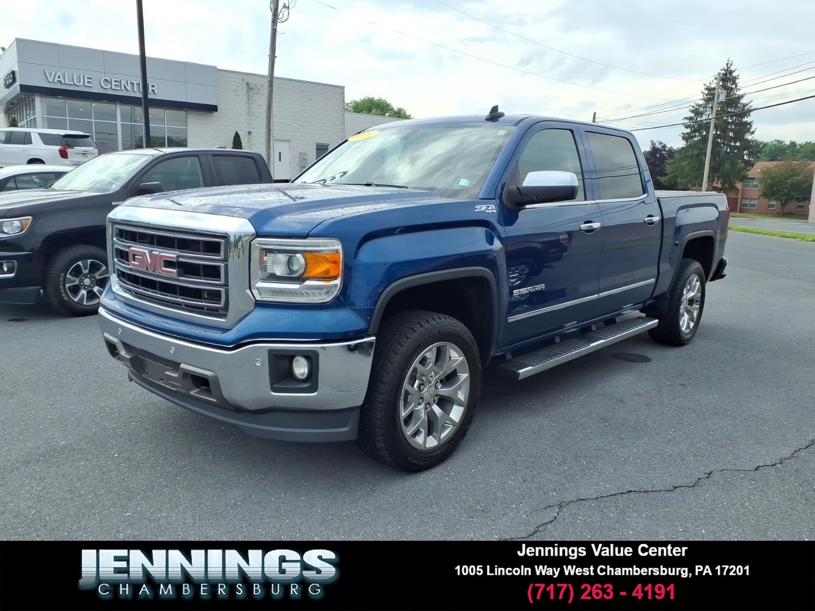 2015 GMC Sierra 1500 SLT in Stone Blue Metallic — front three-quarter view