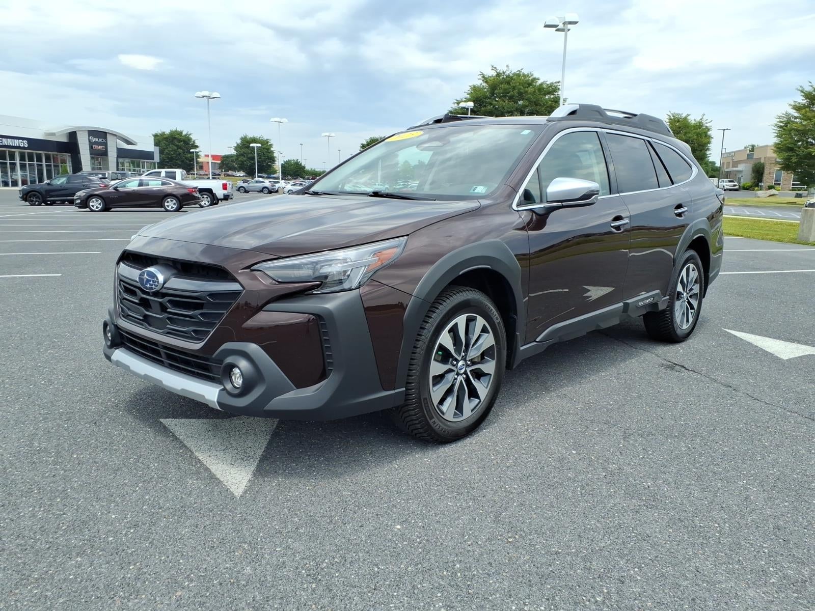 2023 Subaru Outback Touring XT in Red Touring — front three-quarter view